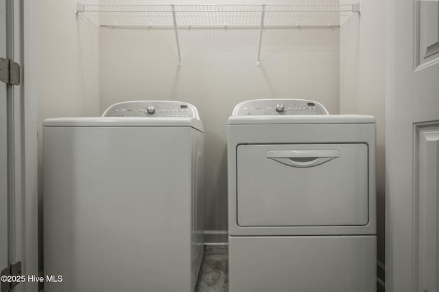 laundry room with independent washer and dryer and laundry area