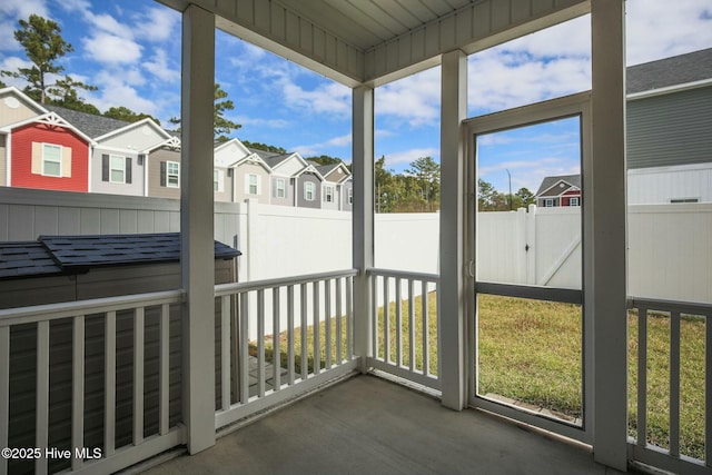 unfurnished sunroom with a residential view