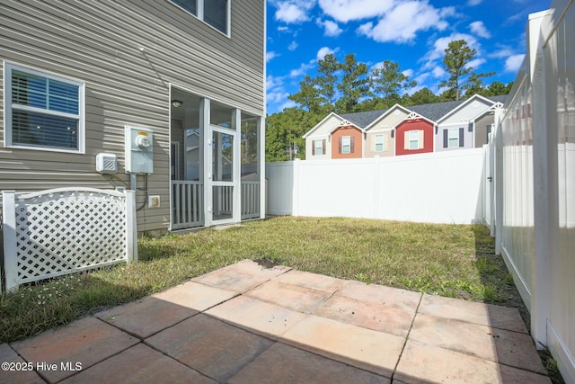 view of yard with a fenced backyard and a patio area