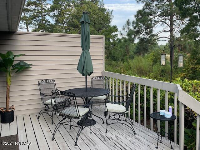 deck with outdoor dining area