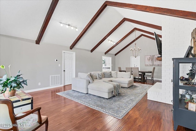 living room featuring baseboards, visible vents, dark wood finished floors, a chandelier, and beam ceiling