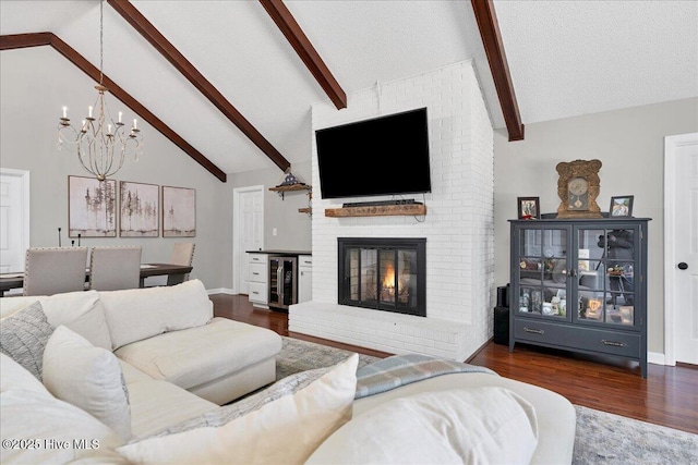 living area featuring wine cooler, a fireplace, beam ceiling, and dark wood-type flooring