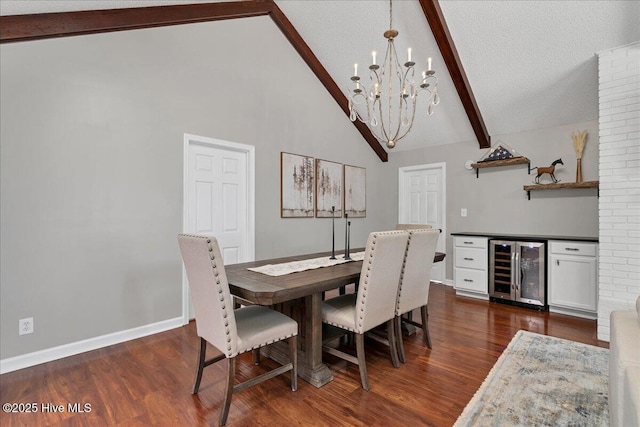 dining room featuring beverage cooler, a textured ceiling, dark wood-style floors, and beam ceiling