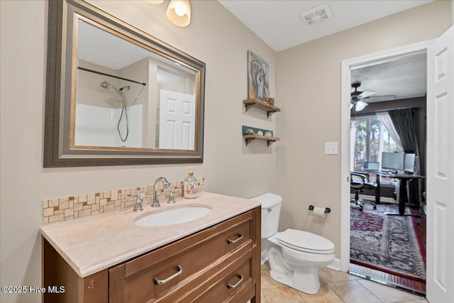 full bathroom with visible vents, toilet, vanity, tile patterned flooring, and walk in shower