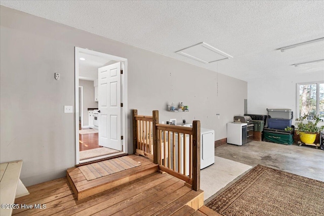 additional living space with a textured ceiling