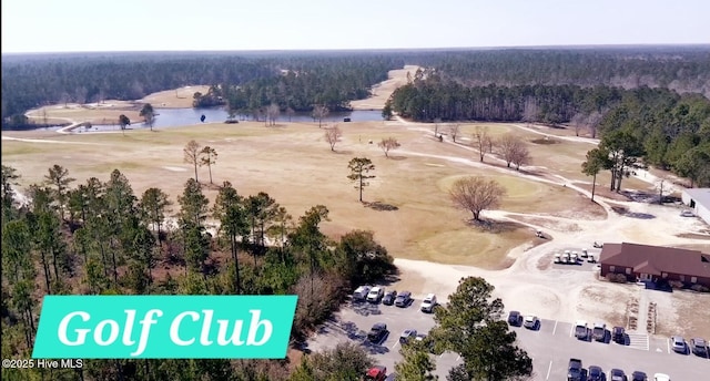 199 Tylers Cove Way, Winnabow, NC 28479 - bird's eye view of a heavily wooded area, a large body of water, and a golf course