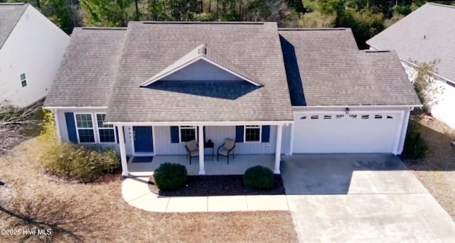 199 Tylers Cove Way, Winnabow, NC 28479 - view of front of home featuring covered porch, a garage, driveway, board and batten siding, and a shingled roof