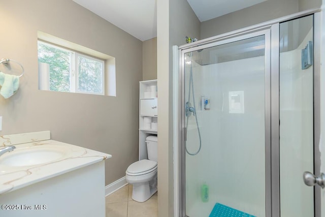 full bathroom with toilet, a shower stall, vanity, tile patterned flooring, and baseboards