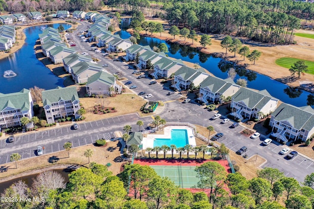 bird's eye view with a water view and a residential view