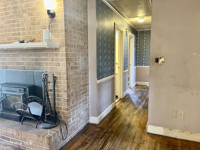 hall with dark wood-style floors and baseboards