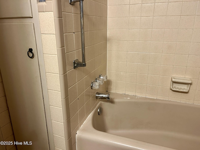 bathroom featuring washtub / shower combination