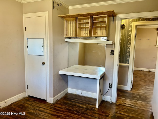 interior space with ornamental molding, baseboards, and wood finished floors