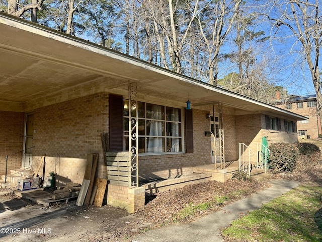 view of front of home featuring brick siding