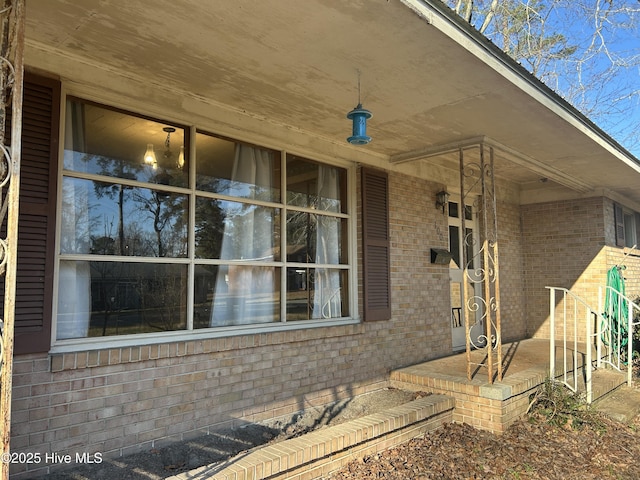 property entrance with brick siding