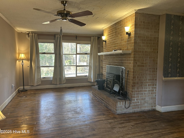 unfurnished living room with dark wood-type flooring, crown molding, baseboards, and ceiling fan