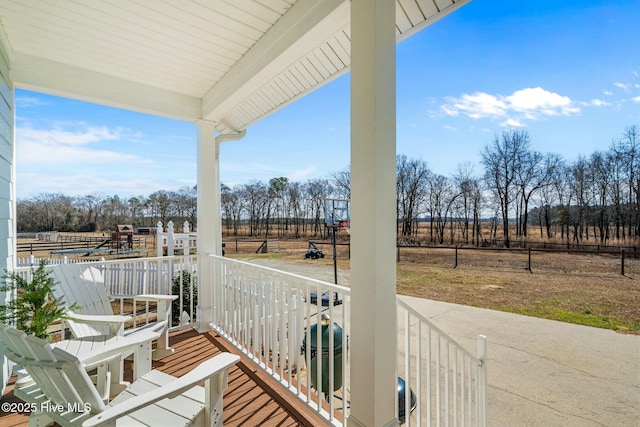 balcony with a porch and a rural view