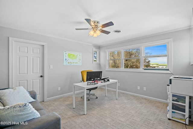 home office featuring crown molding, a ceiling fan, visible vents, and baseboards