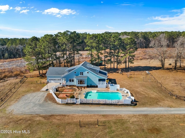 birds eye view of property with a rural view