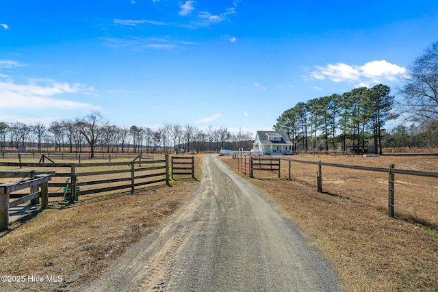 view of street featuring driveway and a rural view