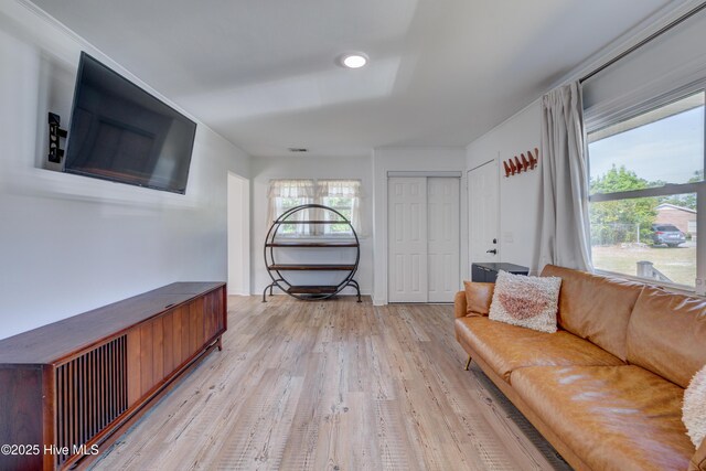 sitting room with light wood-style flooring