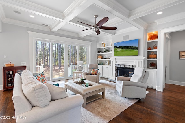 living area with coffered ceiling, a fireplace, dark wood finished floors, and beamed ceiling