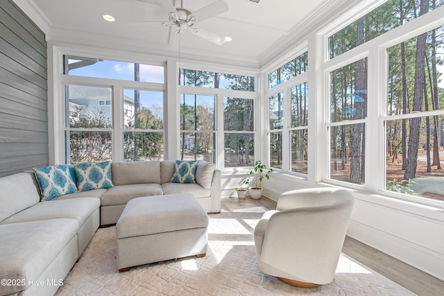 sunroom featuring ceiling fan