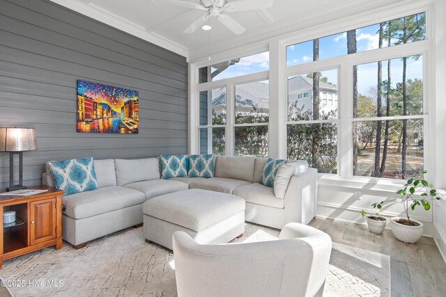 sunroom with plenty of natural light and a ceiling fan