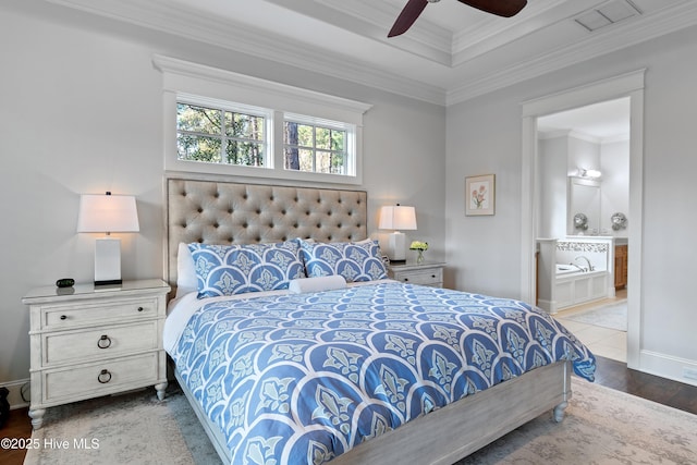 bedroom featuring ensuite bathroom, a ceiling fan, visible vents, baseboards, and ornamental molding