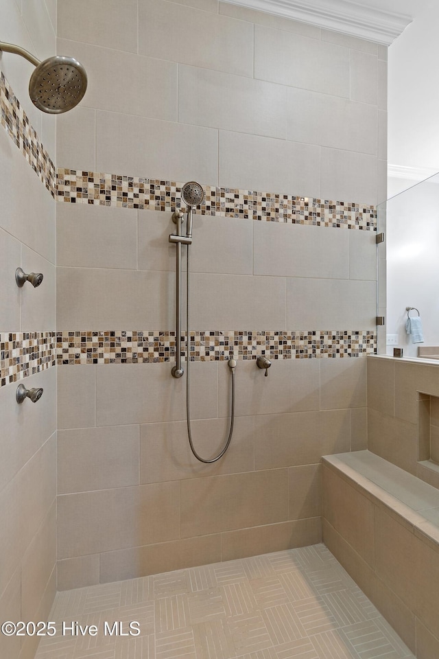 bathroom with a tile shower