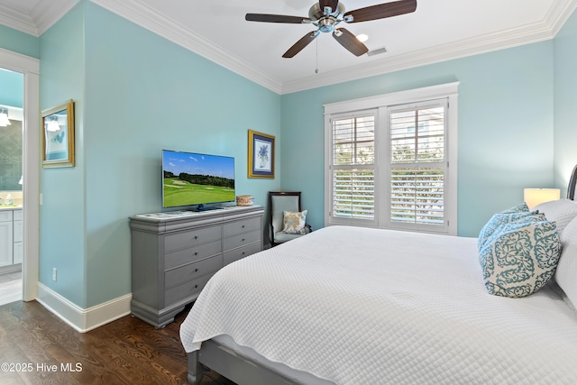 bedroom with baseboards, crown molding, and wood finished floors