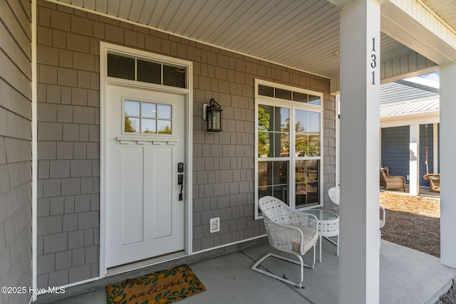 entrance to property featuring a porch