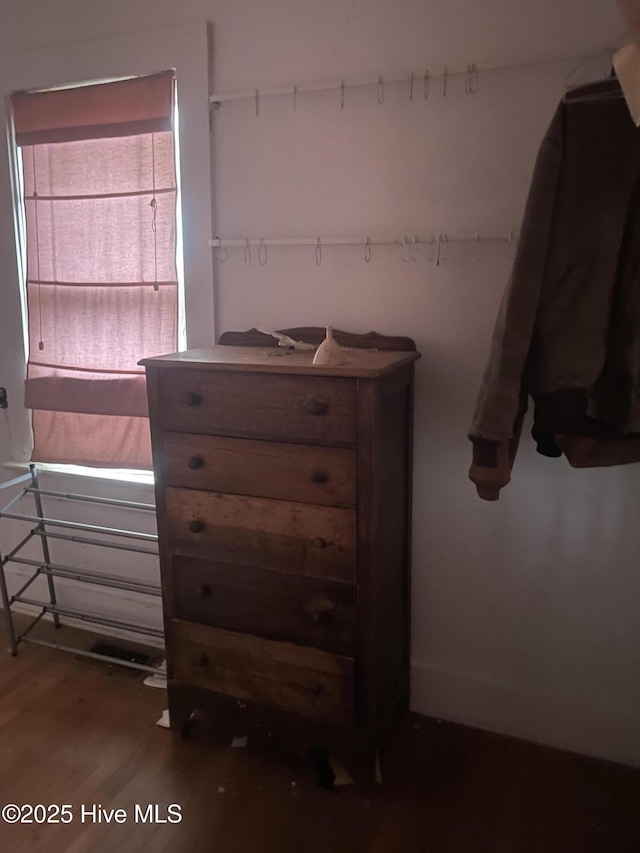 unfurnished bedroom featuring dark wood-type flooring