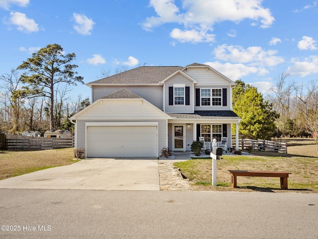 traditional-style house with an attached garage, covered porch, fence, concrete driveway, and a front yard