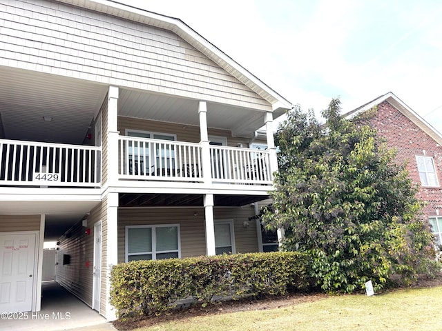 view of side of property featuring a balcony