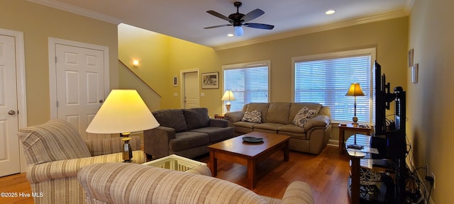 living room with crown molding, a ceiling fan, wood finished floors, and recessed lighting