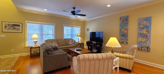 living area with baseboards, recessed lighting, wood finished floors, and crown molding