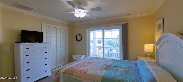 bedroom featuring ornamental molding, a closet, and visible vents