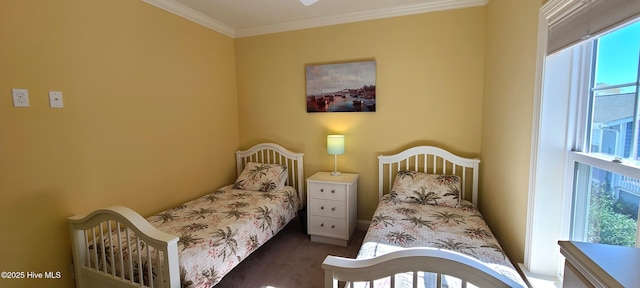 bedroom featuring ornamental molding and dark carpet