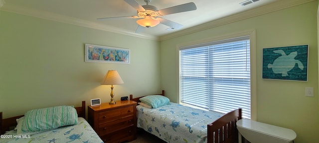 bedroom featuring ceiling fan, ornamental molding, and visible vents