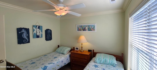 bedroom with visible vents, crown molding, and ceiling fan