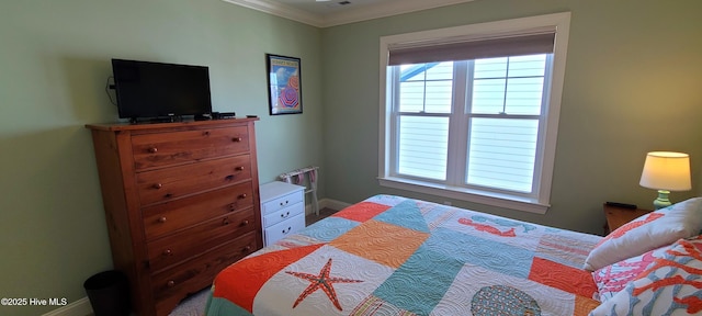 bedroom featuring ornamental molding and baseboards