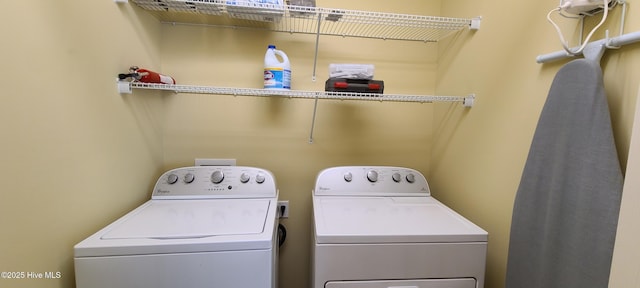 laundry area with laundry area and independent washer and dryer