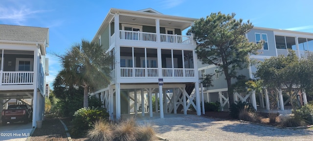 coastal home featuring a carport and driveway