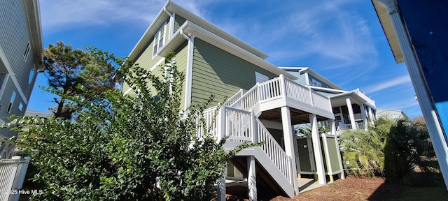 view of side of property with stairs