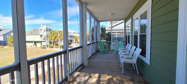 unfurnished sunroom featuring a residential view