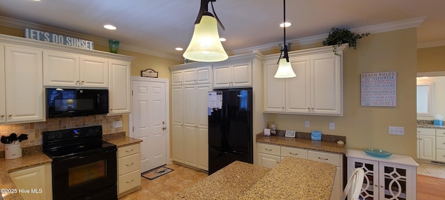 kitchen with hanging light fixtures, black appliances, white cabinetry, and light stone counters