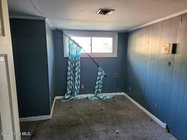 interior space featuring visible vents, crown molding, and baseboards