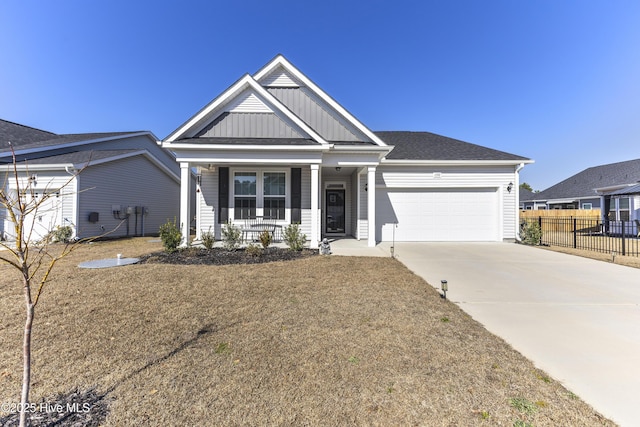 view of front facade featuring a porch, an attached garage, fence, concrete driveway, and board and batten siding