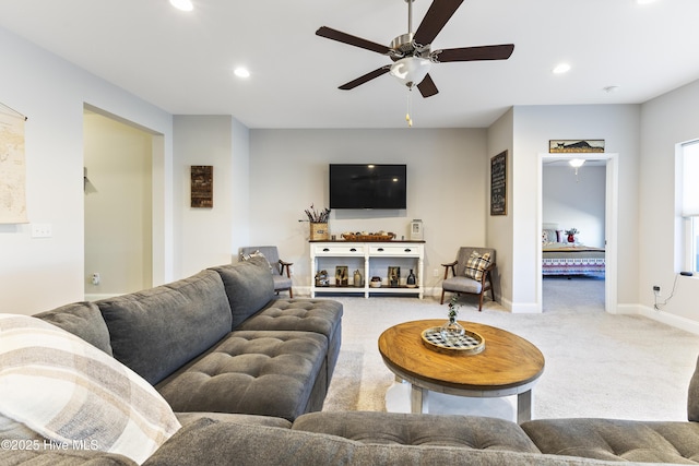 carpeted living area featuring baseboards, ceiling fan, and recessed lighting