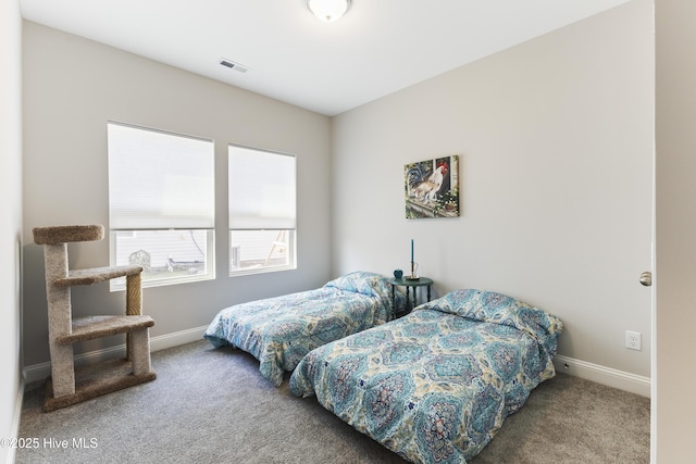 bedroom featuring carpet floors, baseboards, and visible vents